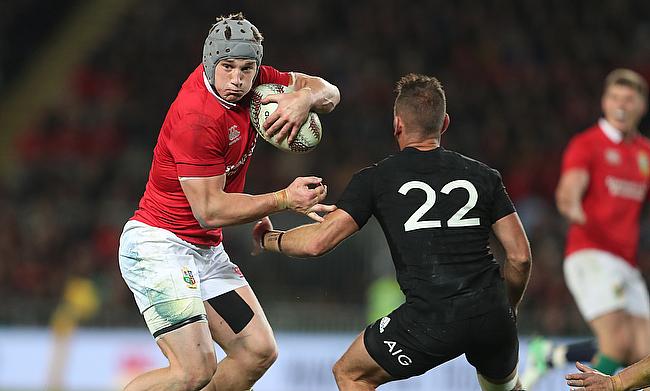 Wales centre Jonathan Davies, left, in action for the British and Irish Lions against New Zealand