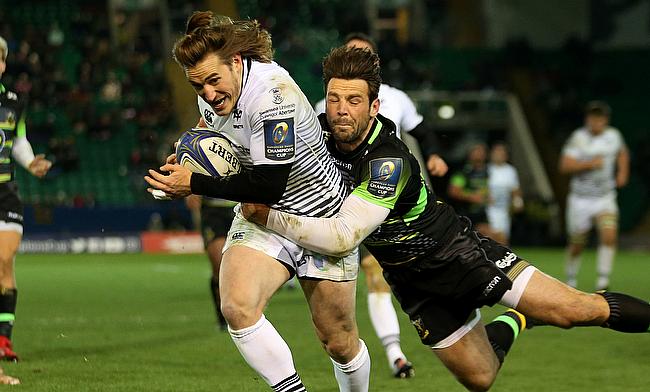 Jeff Hassler (left) goes over for Ospreys' sixth try of the night