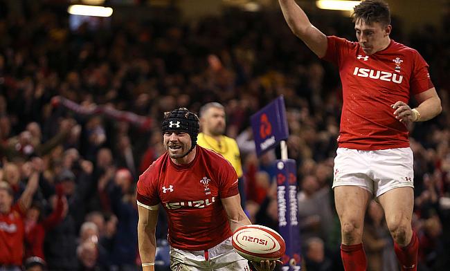 Wales’ Leigh Halfpenny (left) celebrates scoring his side’s third try during the NatWest 6 Nations match at the Principality Stadium, Cardiff