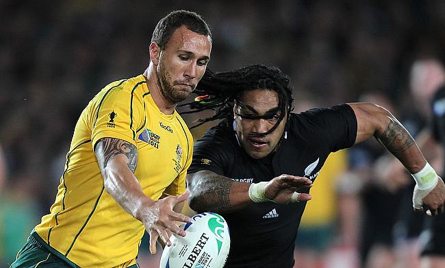 Quade Cooper (left) in action for Australia during the 2011 World Cup