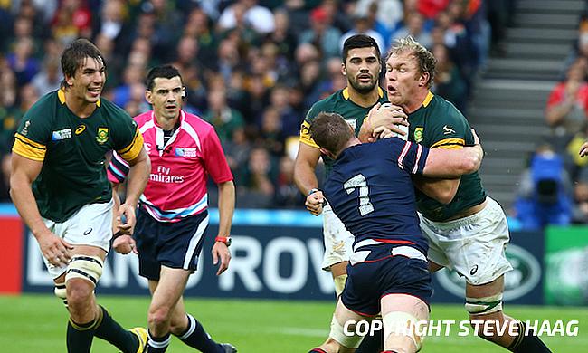 John Quill of the USA tackling Schalk Burger of South Africa