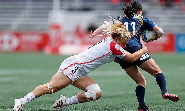 England's Abi Burton tackles against Japan's on day two of the HSBC Canada Women's Sevens at Starlight Stadium on 1st May