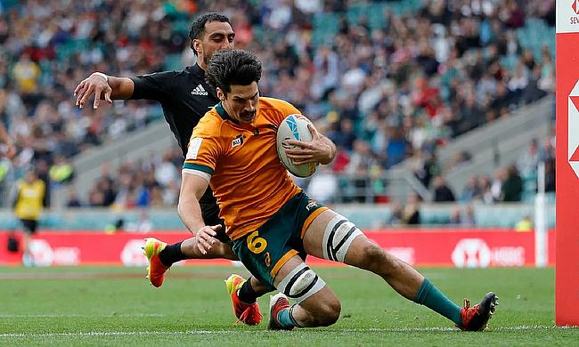 Australia's Henry Paterson scores a try against New Zealand on day two of the HSBC London Sevens at Twickenham Stadium