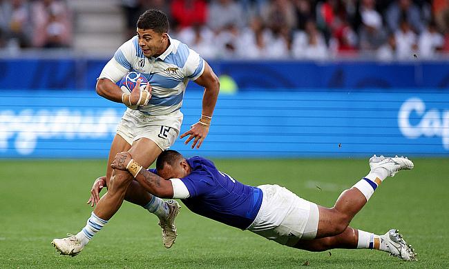 Santiago Chocobares of Argentina is tackled by Alai D'Angelo Leuila of Samoa during the Rugby World Cup game