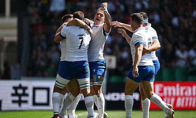 Paolo Garbisi of Italy celebrates with teammates during the game against Namibia