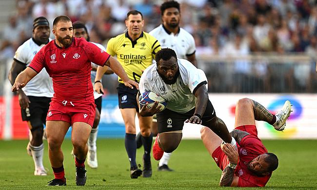 Luke Tagi of Fiji is tackled by Beka Gigashvili of Georgia during the Rugby World Cup game