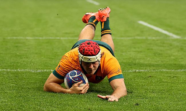 Fraser McReight of Australia scores his team's fourth try during the Rugby World Cup game against Portugal