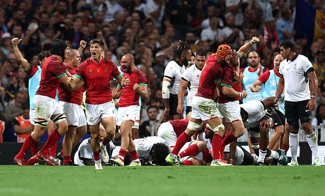 Francisco Fernandes of Portugal celebrates with teammates after scoring his team's second try against Fiji