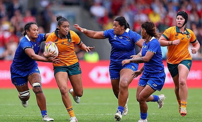 Faitala Moleka of Australia breaks with the ball whilst under pressure from Demielle Onesemo-Tuilaepa of Samoa during the Women's Rugby World Cup 2025