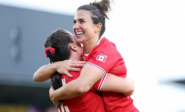 Julia Schell of Canada celebrates victory with teammate Alysha Corrigan after the Women's Rugby World Cup 2025 Pool B match against Fiji