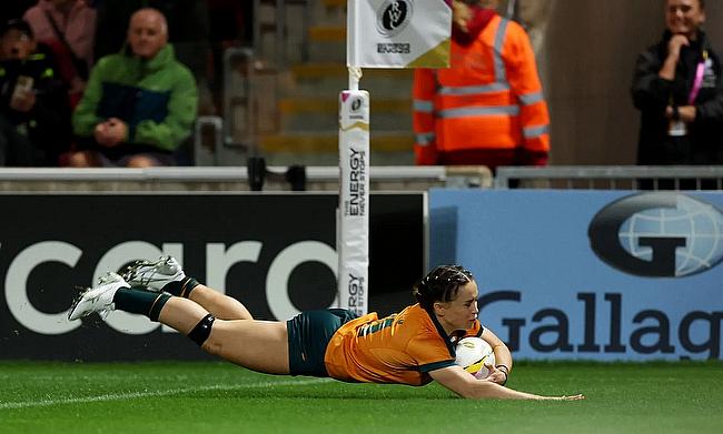 Desiree Miller of Australia scores her team's third try during the Women's Rugby World Cup 2025 Pool A match between USA and Australia