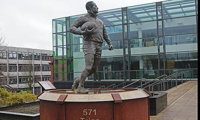 A statue for Sir Billy Boston in Wigan's Believe Square next to Wigan Town Hall.
